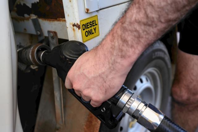 farmer putting gas in ute