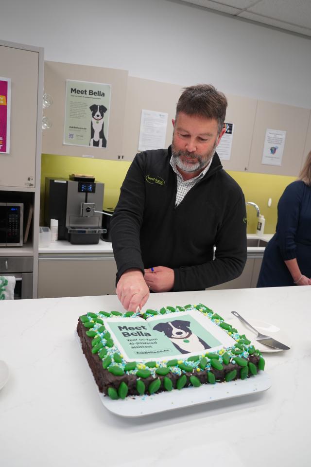 image of Aaron Meikle cutting cake