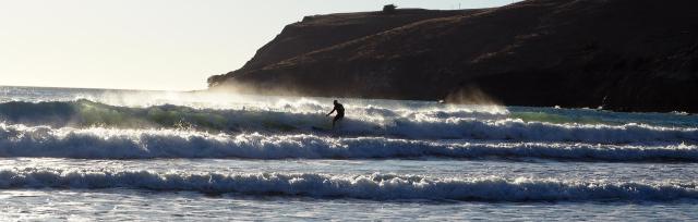 Surfing for Farmers Image of farmer surfing the waves.