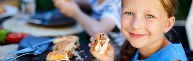 girl eating burger